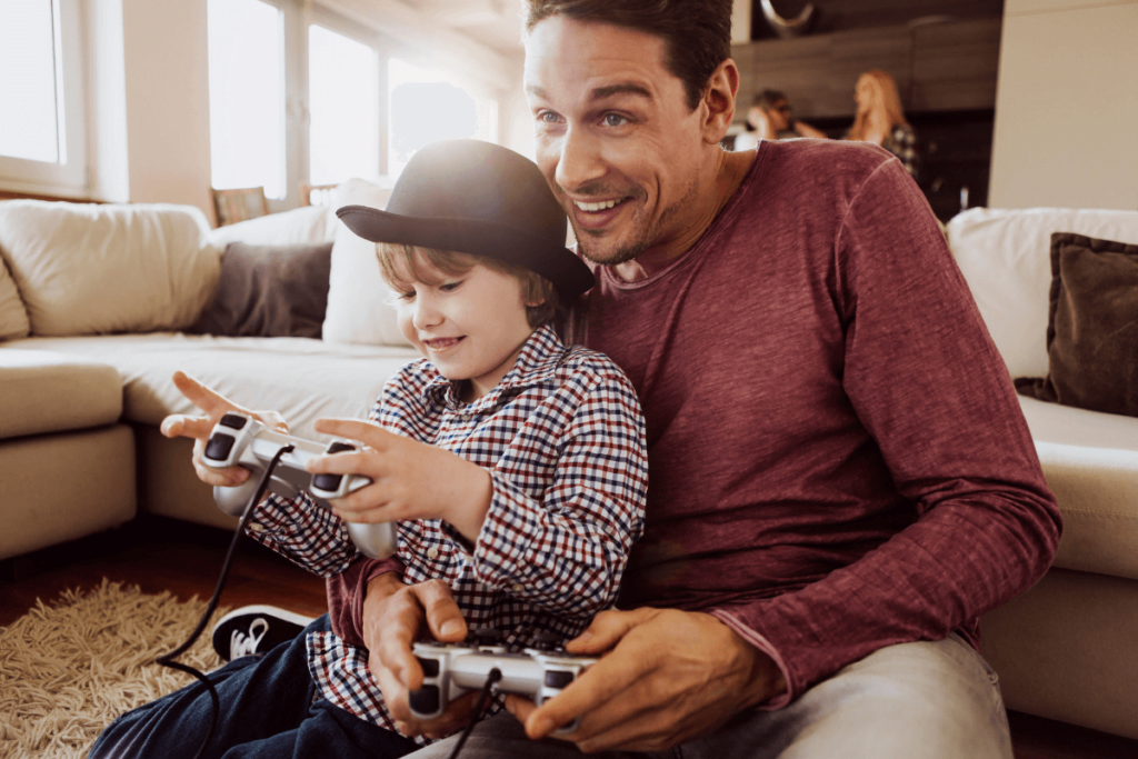 tata i syn grają na konsoli